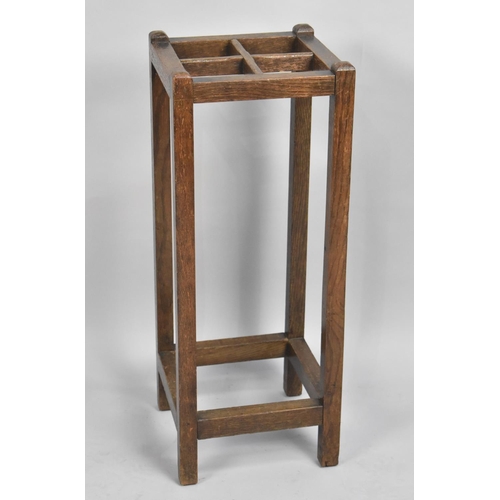 73 - An Edwardian Four Division Oak Stick Stand, 25cms Square and 66cms High