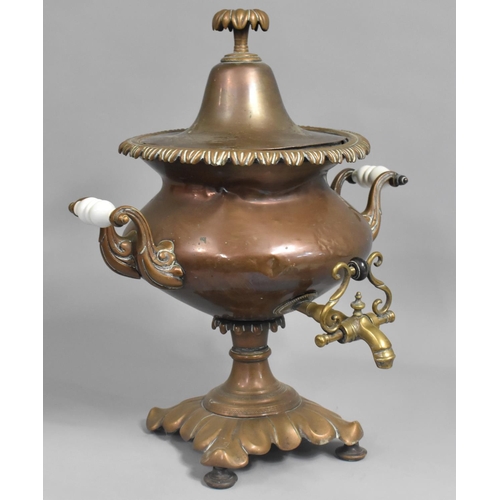 75 - A Late Victorian Copper Samovar with Brass Tap and Ceramic Handles, 48cms High