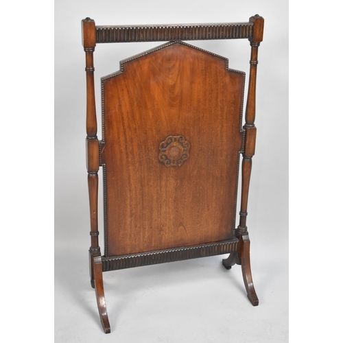 80 - An Edwardian mahogany Fire Screen with Turned Supports, 54cms Wide