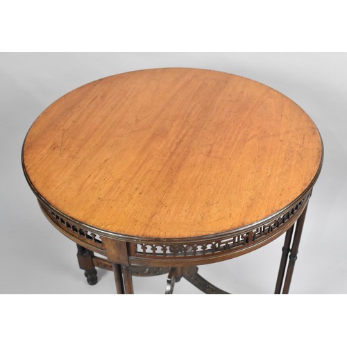 101 - An Edwardian Circular Mahogany Occasional Table with Pierced Border and Stretchers, Triple Circular ... 