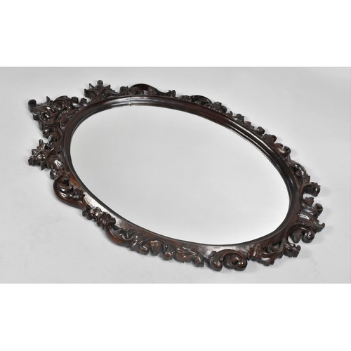 210 - A Late 19th Century Carved and Pierced Framed Oval Wall Mirror, 100cms by 64cms Overall