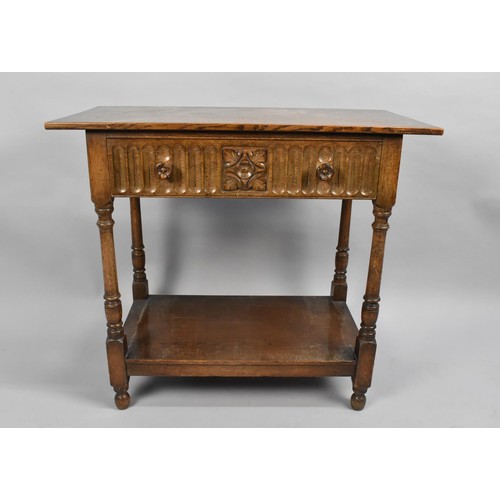 99 - A Mid 20th century Oak Side Table with Single Carved Drawer and Turned Supports, Stretcher Shelf, 84... 