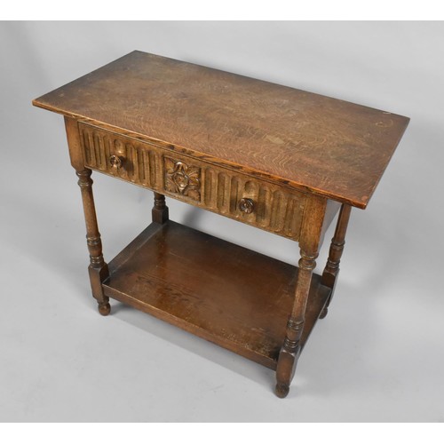 99 - A Mid 20th century Oak Side Table with Single Carved Drawer and Turned Supports, Stretcher Shelf, 84... 