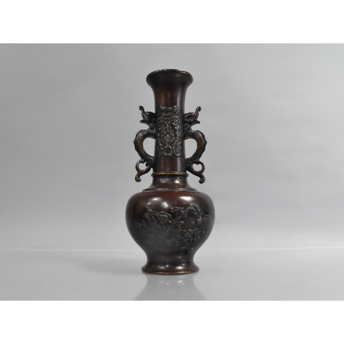 373 - A Japanese Bronze Vase decorated in Shallow Relief to the Body and Neck, Neck with Twin Handles, 26c... 