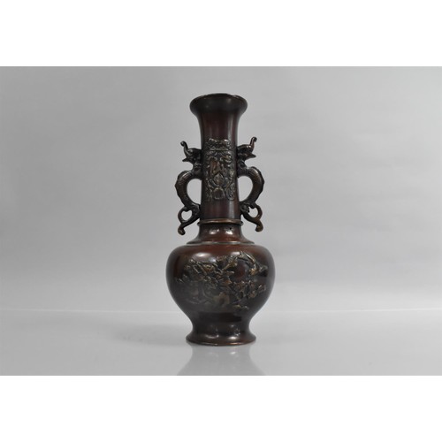 373 - A Japanese Bronze Vase decorated in Shallow Relief to the Body and Neck, Neck with Twin Handles, 26c... 