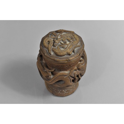 377 - A Chinese Carved Hardwood Pot and Cover Decorated in Relief with Dragon on Circular Base, 16cms High