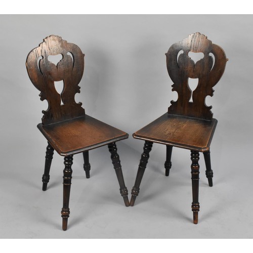 107 - A Pair of Mid 20th Century Pierced Oak Hall Side Chairs on Turned Supports