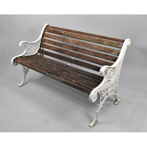 125 - A Wooden Slatted Cast Iron Bench, the Ends of Scrolled Form with Urn and Floral Design, 126cms Wide