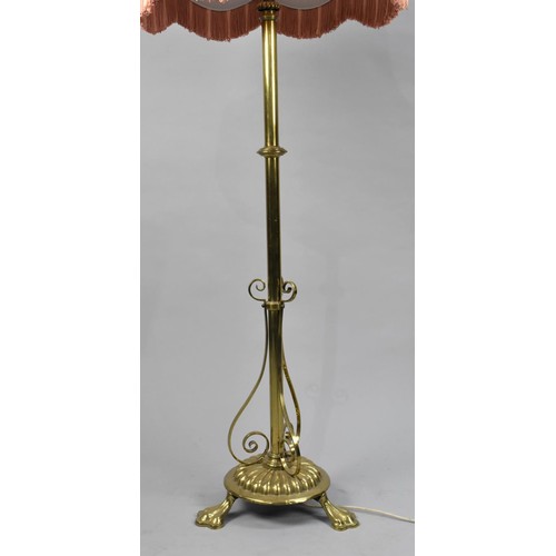 127 - A Mid 20th Century Heavy Brass Standard Lamp having Turned Support and Three Claw Feet, Complete wit... 