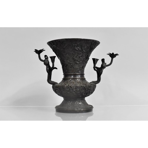 189 - An Oriental Dark Patinated Bronze Vase, The Handles in the Form of Flowers, 18cms High