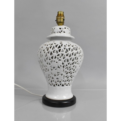 384 - A Chinese Blanc De Chine Lamp Base with Pierced Prunus Design, 34cms High