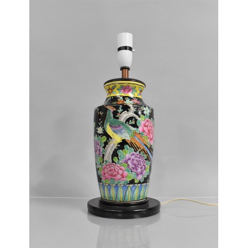 385 - A Chinese Porcelain Vase decorated in the Famille Rose Palette on Black Ground, Now Converted to Tab... 