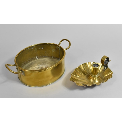 109 - An Oval Brass Pan together with a Brass Bed Chamber Stick with Scalloped Shell Tray