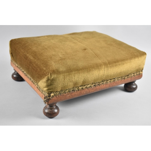 112 - A Late Victorian/Edwardian Upholstered Rectangular Footstool with Four Bun Feet, 41cms Wide