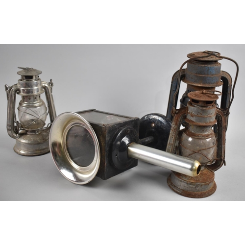 148 - A Collection of Three Graduated Hurricane Lamps and a Converted Trap Lamp