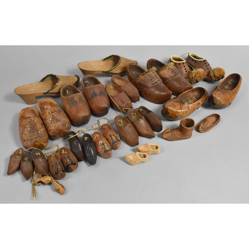 150 - A Collection of Carved Wooden Souvenir Clogs Etc