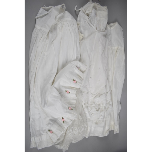 155 - A Collection of Four Christening Gowns and Petticoats