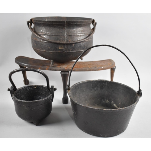 159 - A Cast Iron Cauldron Shaped Glue Pot and Two Larger Cauldrons together with a Fire Front