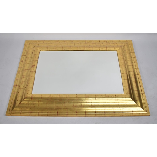 194 - A Modern Gilt Framed Rectangular Wall Mirror with Bevelled Glass, 108x86cms Overall