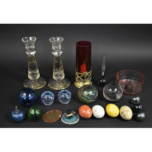 312 - A Collection of Various Glass Paperweights, Polished Stone Eggs, Candle Sticks etc