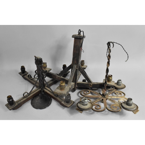 384 - Two Vintage Wrought Iron and Wood Four Branch Candelabra together with a Wrought Iron Example