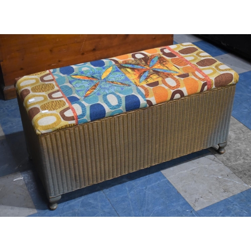 425 - A Lloyd Loom Ottoman with Upholstered Seat, 91cms Wide