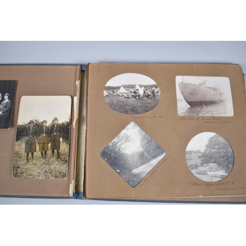 104 - A Vintage Photograph Album Containing Early 20th Century Photographs to Include Several Military