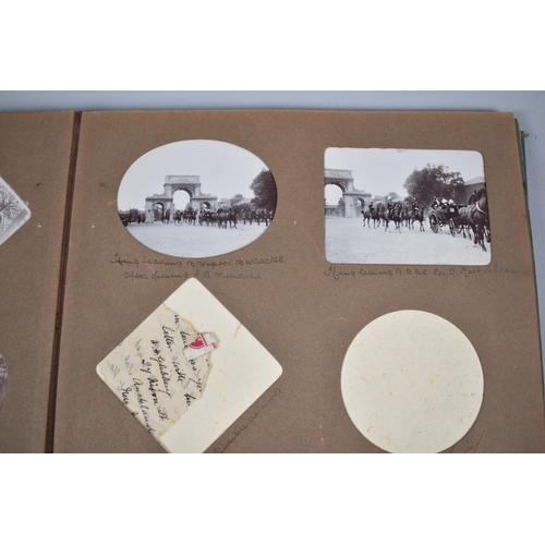 104 - A Vintage Photograph Album Containing Early 20th Century Photographs to Include Several Military