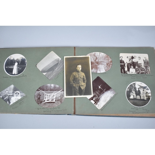 104 - A Vintage Photograph Album Containing Early 20th Century Photographs to Include Several Military