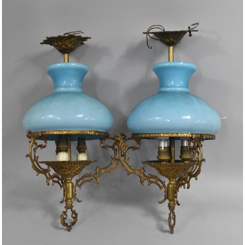 228 - A Pair of Gilt Metal Ceiling Light Fittings with Blue Glass Shades, 45cm high