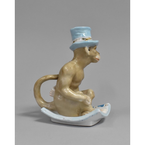 302 - A Porcelain Ceramic Novelty Bedchamber Stick in the Form of Monkey Sat on Cushion, 16cm high