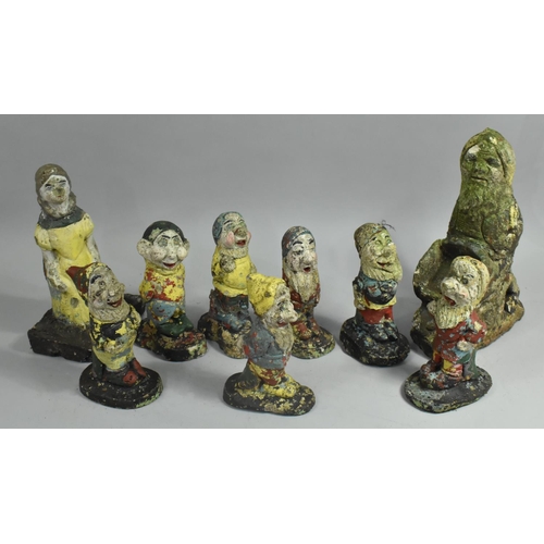 448 - A Set of Reconstituted Stone Garden Ornaments, Snow White and the Seven Dwarves Together with a Furt... 