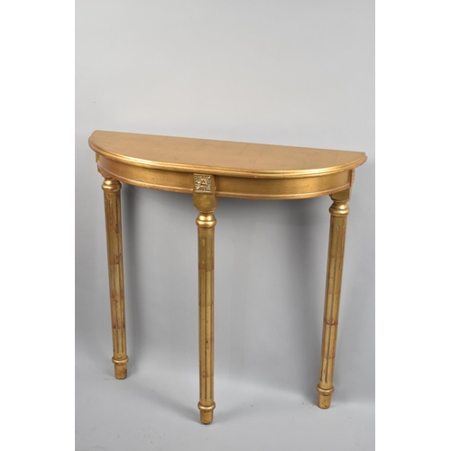 113 - A Gilt Demi Lune Console Table on Reeded Turned Supports, 82cm wide