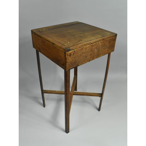 122 - An Edwardian Oak Sewing Box with hinged Lid and Stretcher Shelf, 33cm wide