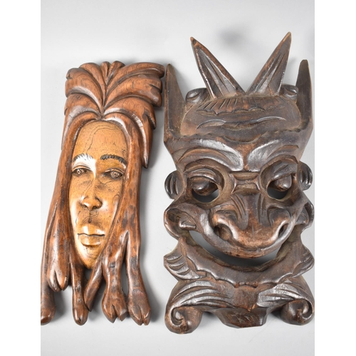 126 - Two Souvenir Carved Wooden Masks, 30cm high