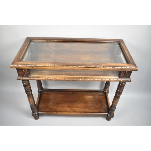 13 - An Edwardian Oak Bijouterie Table with Glazed Hinged Top, Turned Supports and Galleried Stretcher Sh... 