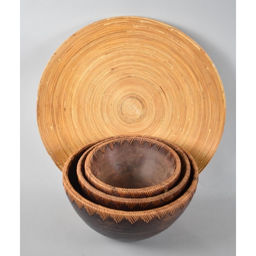 141 - A Collection of Three Graduated African Wooden Bowls and a Charger, 45cm diameter