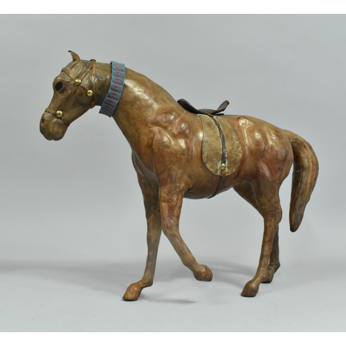 155 - A Continental Leather Covered Study of a Horse, 35cm long