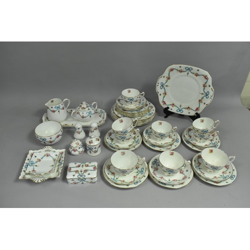 268 - A Crown Staffordshire Rose and Blue Ribbon Swag Decorated Tea Set to comprise Nine Cups, Eight Sauce... 