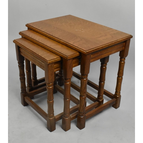 458 - A Mid 20th Century Nest of Three Oak Table, 50cm wide