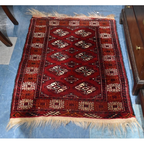 472 - A Patterned Woollen Rug, 105x78cm