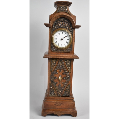 20 - An Edwardian Brass Mounted Oak Novelty Mantel Clock in the Form of a Long Cased Clock, 39cms High