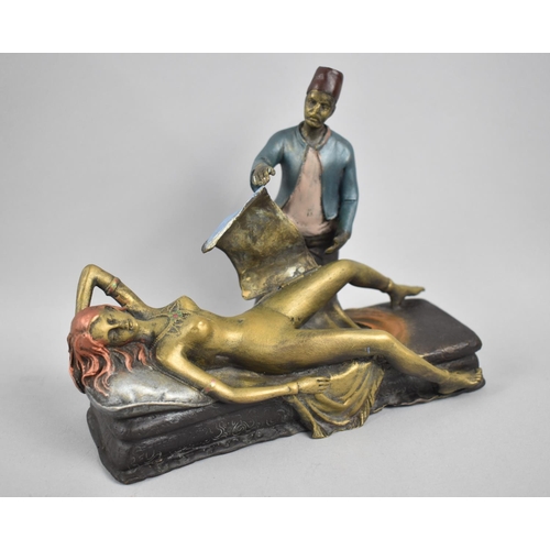 24 - A Reproduction Bronze Novelty Risque Figure Group in the Bergmann Style Depicting Magician Standing ... 