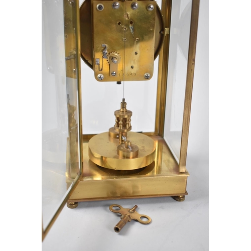 5 - An Early 20th Century Gilt Brass Cased Four Glass Clock with Torsion Movement, White Enamelled Dial ... 