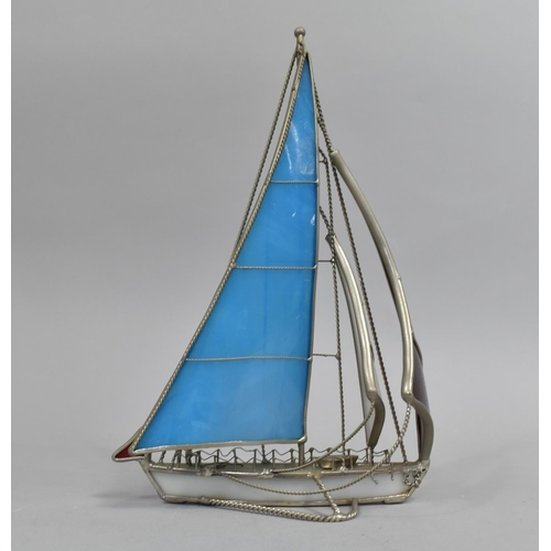10 - A Modern Silver Plated and Resin Model of a Sailing Yacht, 26.5cms High