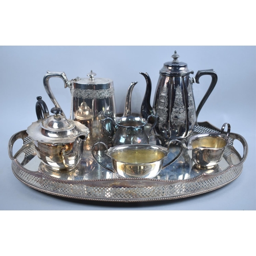 119 - An Edwardian Oval Two Handled Silver Plated Tray with Pierced Gallery, together with Three Piece Sil... 