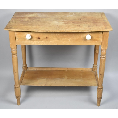 131 - A Stripped Pine Side Table With Single Drawer and Stretcher Shelf