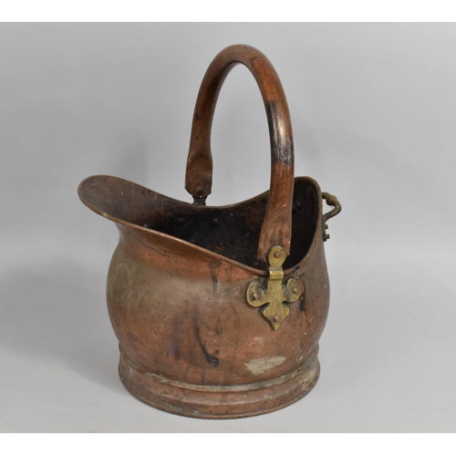 136 - A Vintage Copper Helmet Shaped Coal Scuttle, 43cm high
