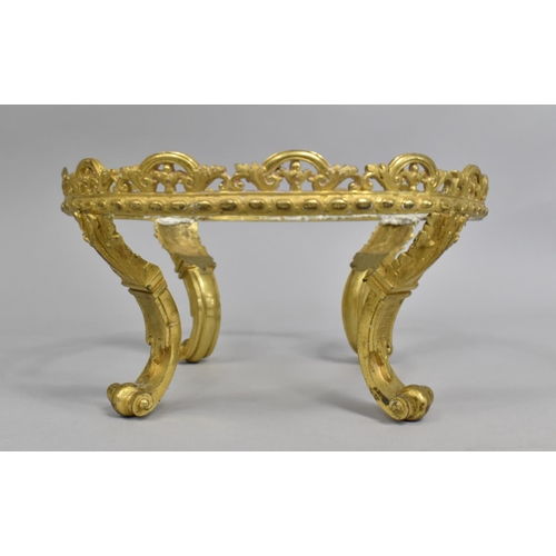 174 - A Gilt Metal Circular Stand on Four Scrolled Feet, 23cm Diameter