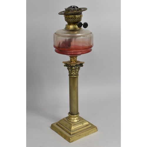 23 - A Victorian Brass Oil Lamp of Corinthian Column Form with Clear Glass Reservoir, Stepped Square Base... 